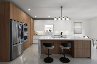 Mid-sized trendy l-shaped porcelain tile and white floor open concept kitchen photo in New York with an undermount sink, flat-panel cabinets, medium tone wood cabinets, quartz countertops, white backsplash, quartz backsplash, stainless steel appliances, an island and white countertops