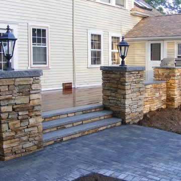Deck and stone wall.