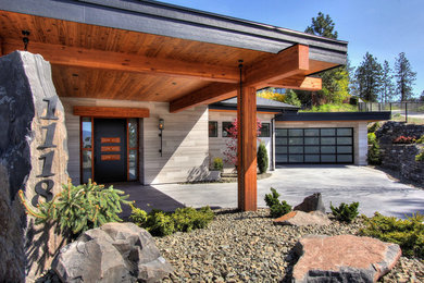 This is an example of a contemporary attached two-car porte cochere in Vancouver.