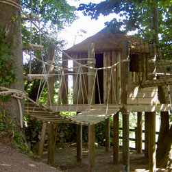 Family forest play area with rope bridge and treetop walkway. - Garden Playhouses