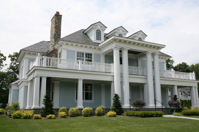 Large traditional blue two-story concrete fiberboard exterior home idea in New York