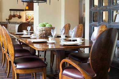 Example of a classic dark wood floor dining room design in Little Rock with beige walls