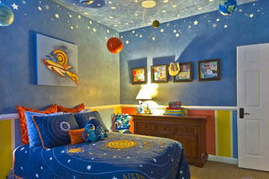 Design ideas for a contemporary kids' bedroom for kids 4-10 years old and boys in Orlando with blue walls and carpet.