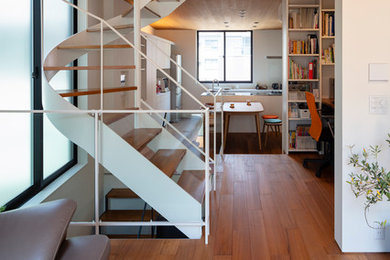 Inspiration for a modern open concept plywood floor and brown floor living room remodel in Tokyo with white walls, no fireplace and a tv stand