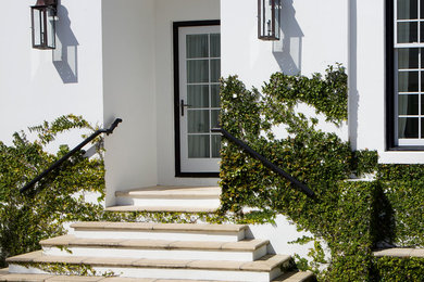 Patio - mid-sized mediterranean side yard patio idea in Miami with no cover