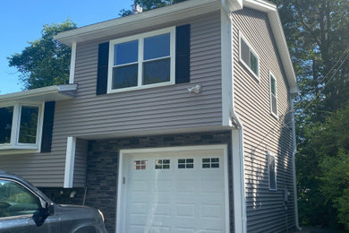 Garage - contemporary attached garage idea in Boston