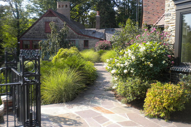 This is an example of a traditional backyard stone landscaping in New York.