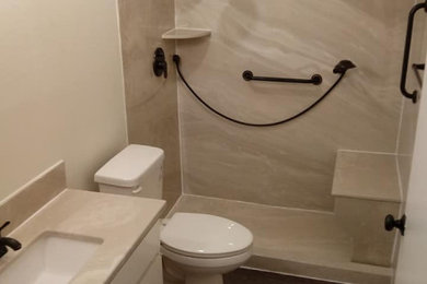 Example of a mid-sized minimalist 3/4 beige tile and marble tile wood-look tile floor, brown floor and single-sink bathroom design in Dallas with a one-piece toilet, marble countertops, a built-in vanity and an undermount sink
