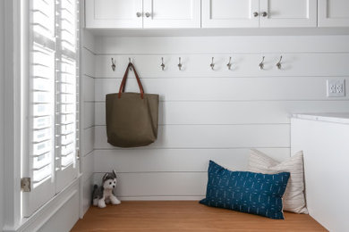 Elegant ceramic tile and gray floor utility room photo in Other with an undermount sink, shaker cabinets, white cabinets, marble countertops, gray walls, a side-by-side washer/dryer and white countertops
