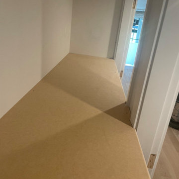 Custom shelving and hidden door
