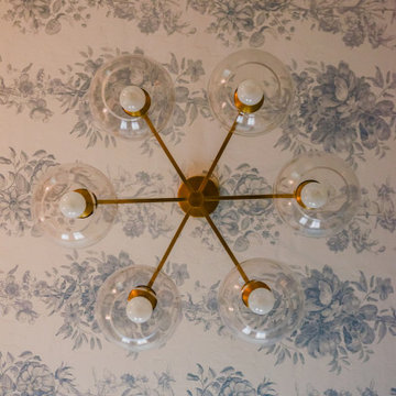 Bedroom interior with wallpapered ceiling