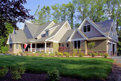 Large traditional green two-story mixed siding gable roof idea in Other