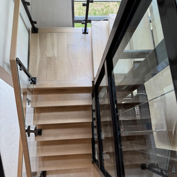 Project #136 | Modern Floating Staircase Encircling Glass Elevator