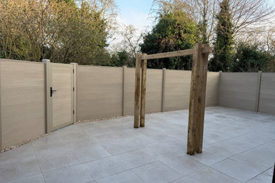 Contemporary Porcelain Patio with Composite Fencing