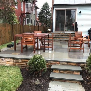 Removal of existing deck-Replaced with flagstone and E.P Henry Cast Wall