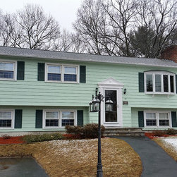 Metal Roof on Split-level Home - Roofing And Gutters