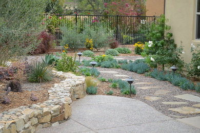 Inspiration for a mid-sized mediterranean full sun backyard stone garden path in San Diego for summer.
