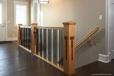 Design ideas for an arts and crafts carpeted straight staircase in Edmonton with carpet risers and mixed railing.