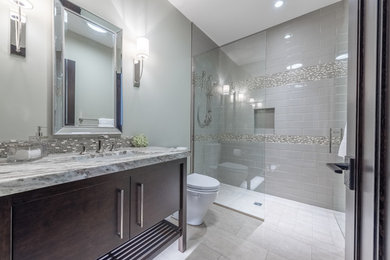 Inspiration for a craftsman gray tile and ceramic tile porcelain tile and gray floor walk-in shower remodel in Other with a hinged shower door