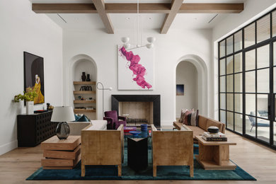 Living room - contemporary light wood floor, beige floor and exposed beam living room idea in Other with white walls and a standard fireplace