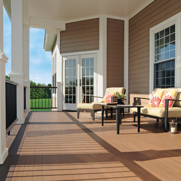AZEK Porch in Morado. Premier Rail in Kona® with Round Aluminum Balusters