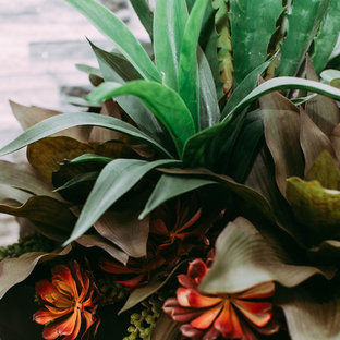 Design ideas for a large modern home office and library in Edmonton with grey walls, ceramic flooring and a hanging fireplace.