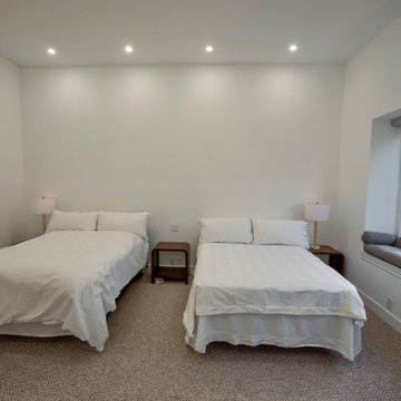 Guest Bedroom With Built-In Window Seat