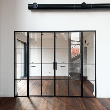Double industrial-style steel doors with side panels