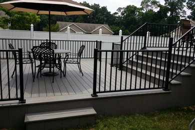 Large backyard deck photo in Other with no cover