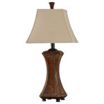 Stylecraft - Archer Table Lamp, Faux Wood and Nailhead Trim, Light Beige, Trim Fabric Shade - Pairing a light beige shade with a graceful frame featuring a brown faux wood finish with black nailhead accents, the Archer Table Lamp is the highlight of any tabletop. Matching light beige trim highlights the square bell shape of the fabric shade, echoing the hourglass curves of the frame. With its neutral colors and eye-catching embellishments, this table lamp is sure to make an impression in an office, bedroom, living room, or hallway.