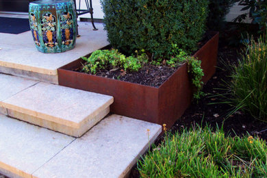 This is an example of a large modern drought-tolerant and partial sun front yard stone and wood fence garden path in Other for winter.