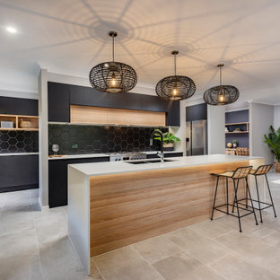 Design ideas for a mid-sized contemporary galley open plan kitchen in Sunshine Coast with an undermount sink, black splashback, with island and grey floor.