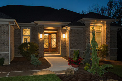 Mid-sized modern black one-story brick exterior home idea in Cincinnati with a hip roof