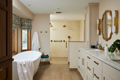 Example of a huge transitional master ceramic tile, beige floor and double-sink bathroom design in Minneapolis with shaker cabinets, beige cabinets, beige walls, an undermount sink, quartz countertops, a hinged shower door, beige countertops and a built-in vanity