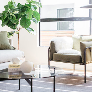 Olive Green Campaign Style Chair and Fiddle Leaf Fig with Cobra Lamp