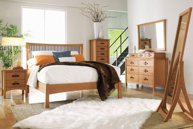 Mid-sized zen guest ceramic tile and beige floor bedroom photo in Milwaukee with white walls and no fireplace