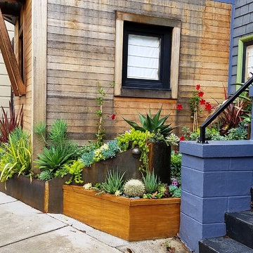 Succulent garden with custom weathered steel and hardwood planters
