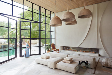 Example of a large minimalist living room design in Phoenix with beige walls