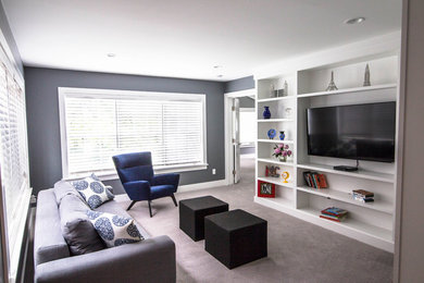 Mid-sized trendy enclosed and formal carpeted and beige floor living room photo in Detroit with no fireplace, a media wall and gray walls