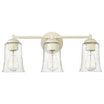 Millennium Lighting - 3 Light 21.75 in. Cottage White Vanity Light - Vintage-inspired, tapered, bell-shaped seedy glass globes give the Abilene Family of vanity lighting an unparalleled design signature rooted in turn-of-the-century American design. Finished in either matte black or cottage white, these fixtures are available in 1-light, 2-light, and 3-light options and are further embellished with stylish brushed gold sockets.