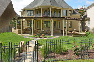 Patio - mid-sized mediterranean backyard stone patio idea in Other with a fire pit and a pergola