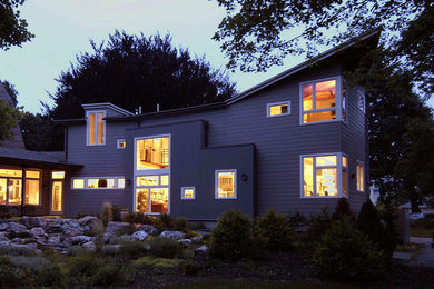 Photo of a contemporary exterior in Boston with wood siding.