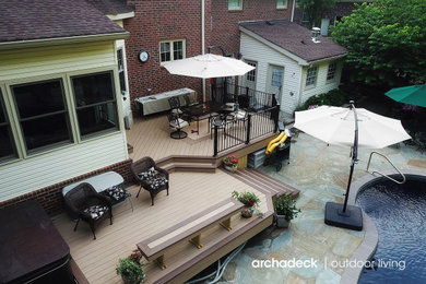 Inspiration for a contemporary backyard metal railing deck remodel in Nashville