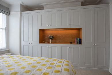 Wardrobes in front of chimney breast