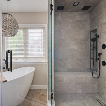Bathroom Remodel in Sterling, VA Tub, glass shower, double vanity, stone wall