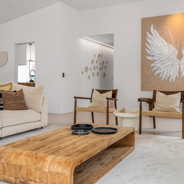 Living room sofa beneath white wing artwork, Alfragide