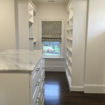 Smooth white melamine walk-in closet in Ridgewood NJ.