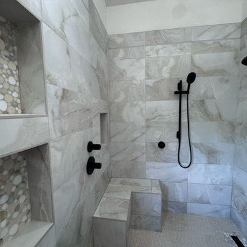 Curd-less walk-in shower; heated floors in bathroom + shower+bench LED