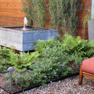A wrap around garden with fabulous water features!