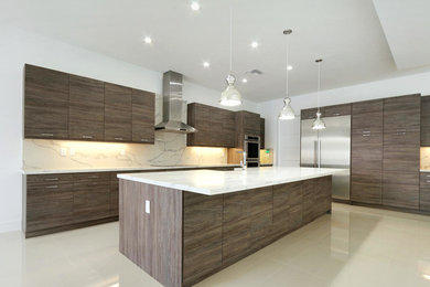 Open concept kitchen - huge contemporary l-shaped porcelain tile and beige floor open concept kitchen idea in Miami with a farmhouse sink, flat-panel cabinets, brown cabinets, quartz countertops, white backsplash, stone slab backsplash, stainless steel appliances and an island